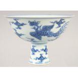 A CHINESE BLUE AND WHITE PORCELAIN STEM CUP with dragon and phoenix. 15.5cm diameter.