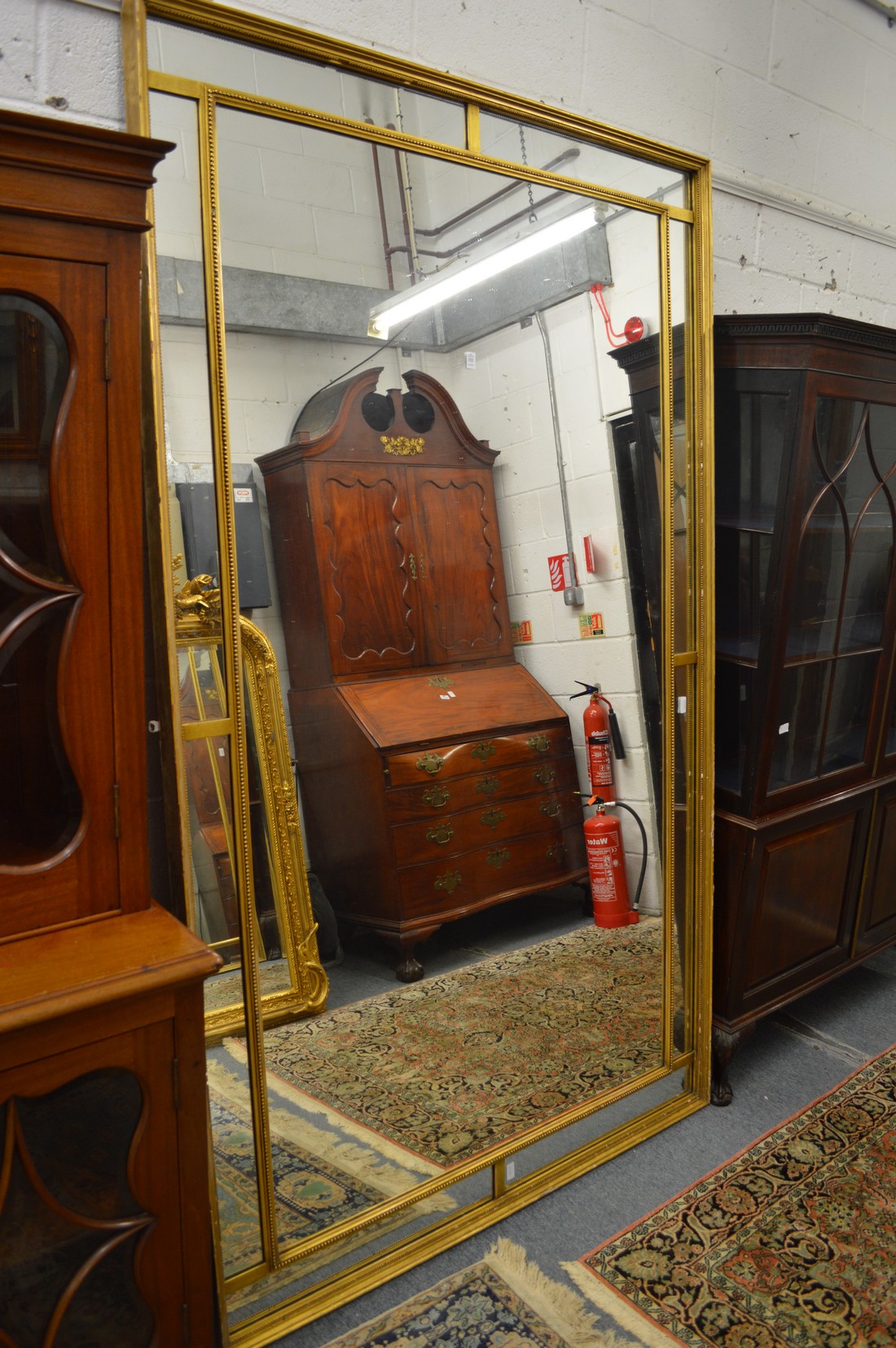 A GOOD LARGE GILT FRAMED RECTANGULAR MIRROR. 7ft 6ins x 4ft 6ins.