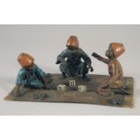 A VIENNA COLD CAST BRONZE "Boys playing dice" sitting on a rug.
