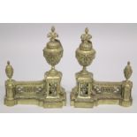 A GOOD PAIR OF 19TH CENTURY CAST BRASS CHENETS with urn finials. 1ft 3ins high, 11ins wide.