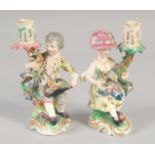 AN EARLY 19TH CENTURY DERBY PAIR OF CANDLESTICK FIGURES.