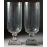 A GOOD PAIR OF CUT GLASS STORM LAMPS on square stepped bases. 15ins high.