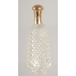 A CARVED CUT GLASS SCENT BOTTLE with 18ct gold top. 3.25ins.