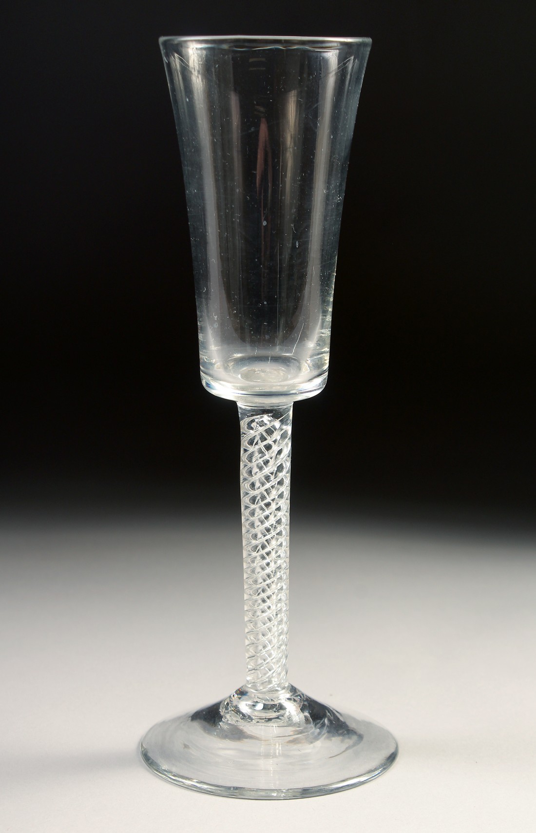 AN 18TH CENTURY TALL PLAIN ALE GLASS with air twist stem. 7.75ins high. - Image 2 of 4