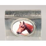A SMALL SILVER BOOK SHAPED COMPACT with an enamel of a horse. 1.75ins x 1in.