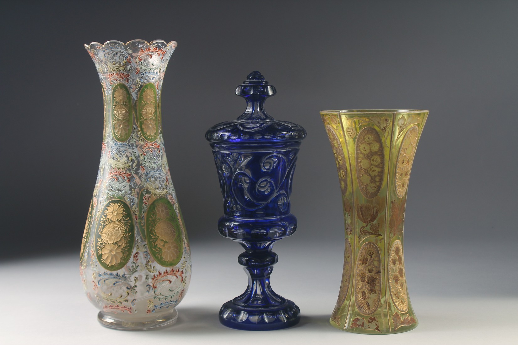 THREE VARIOUS BOHEMIAN GLASS VASES one with a cover. 13ins, 10ins & 9.5ins high. - Image 3 of 6