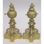 A GOOD PAIR OF 19TH CENTURY CAST BRASS CHENETS with three scrolling supports and base. 1ft 5ins