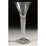 AN 18TH CENTURY TAPERING WINE GLASS with air twist stem. 6ins high.