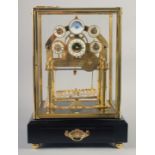 A VERY GOOD GILT MOONPHASE CONGREAVE CLOCK with six dials in a glass frame, the base with single