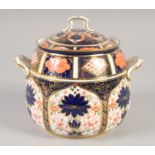 A ROYAL CROWN DERBY LARGE TWO HANDLED COVERED JAR painted in pattern 1128, date mark 1925.