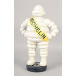 A CAST IRON MICHELIN MAN. 16ins high.