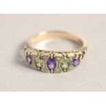 A 9CT GOLD AMETHYST, PERIDOT AND DIAMOND RING.