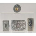 THREE WHITE METAL SNUFF BOXES AND A ROUND SNUFF BOX. (4).