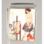 A SILVER ENAMEL PILL BOX "Nude".