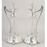 A GOOD PAIR OF W.A.P. PLATE AND GLASS TAPERING CLARET JUGS. 20ins high.