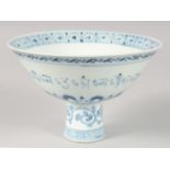 A CHINESE BLUE AND WHITE PORCELAIN STEM CUP, with a band of characters to the exterior and bearing