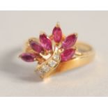 A GOLD, RUBY, AND DIAMOND RING.