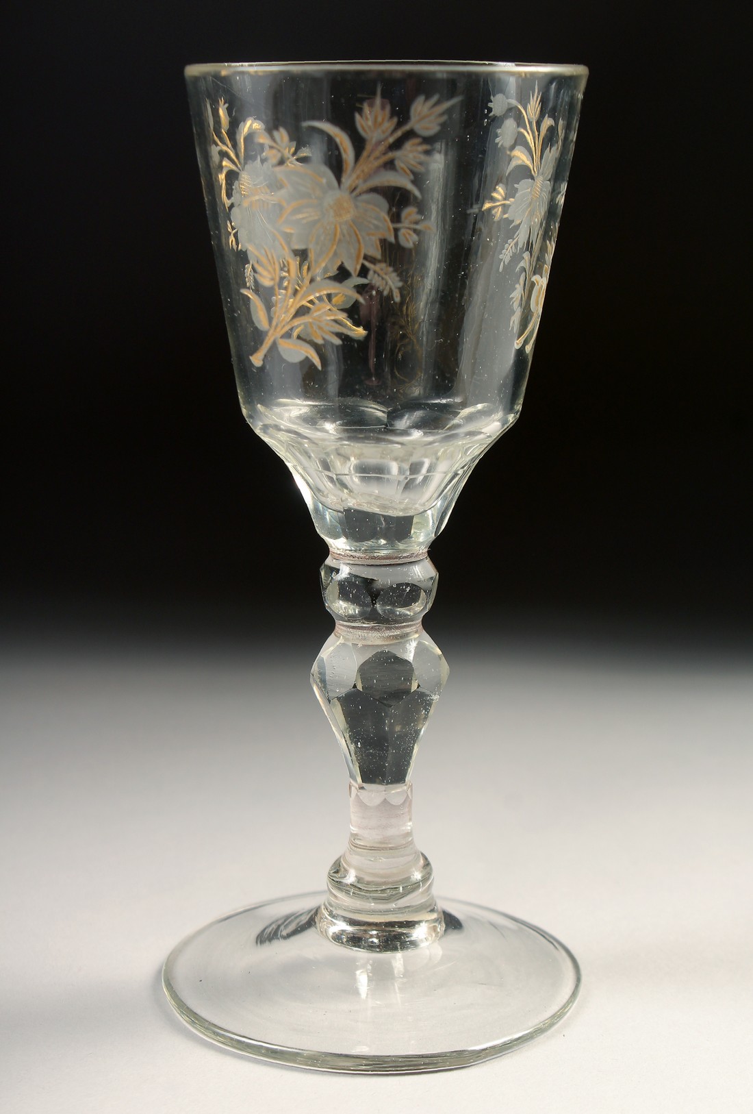 AN 18TH CENTURY DUTCH WINE GLASS with facet stem, the bowl engraved with flowers. 6ins high. - Image 2 of 4