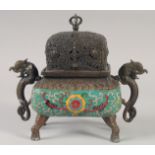 A CHINESE BRONZE TWIN HANDLED CENSER AND COVER with cloisonne decoration and raised on four elephant