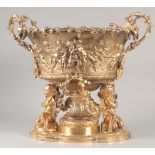 A SUPERB GILT BRONZE CHERUB CENTRE PIECE hung with fruiting vines and cupids. 16ins high x 16ins