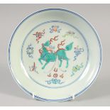 A CHINESE DOUCAI PORCELAIN DISH with Kylin and lucky objects. 21.5cm diameter.