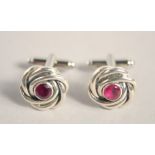 A PAIR OF SILVER RUBY KNOT CUFF LINKS