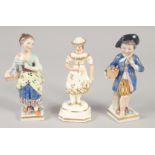 A 19TH CENTURY STAFFORDSHIRE PORCELAIN FIGURE OF A GIRL wearing a hat. and A PAIR OF CONTINENTAL