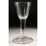 A PLAIN 18TH CENTURY HEAVY WINE GLASS with plain stem. 6ins high.