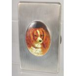 A GOOD LARGE HEAVY ENGINE TURNED CIGARETTE CASE with and oval enamel of a King Charles Spaniel. 5.