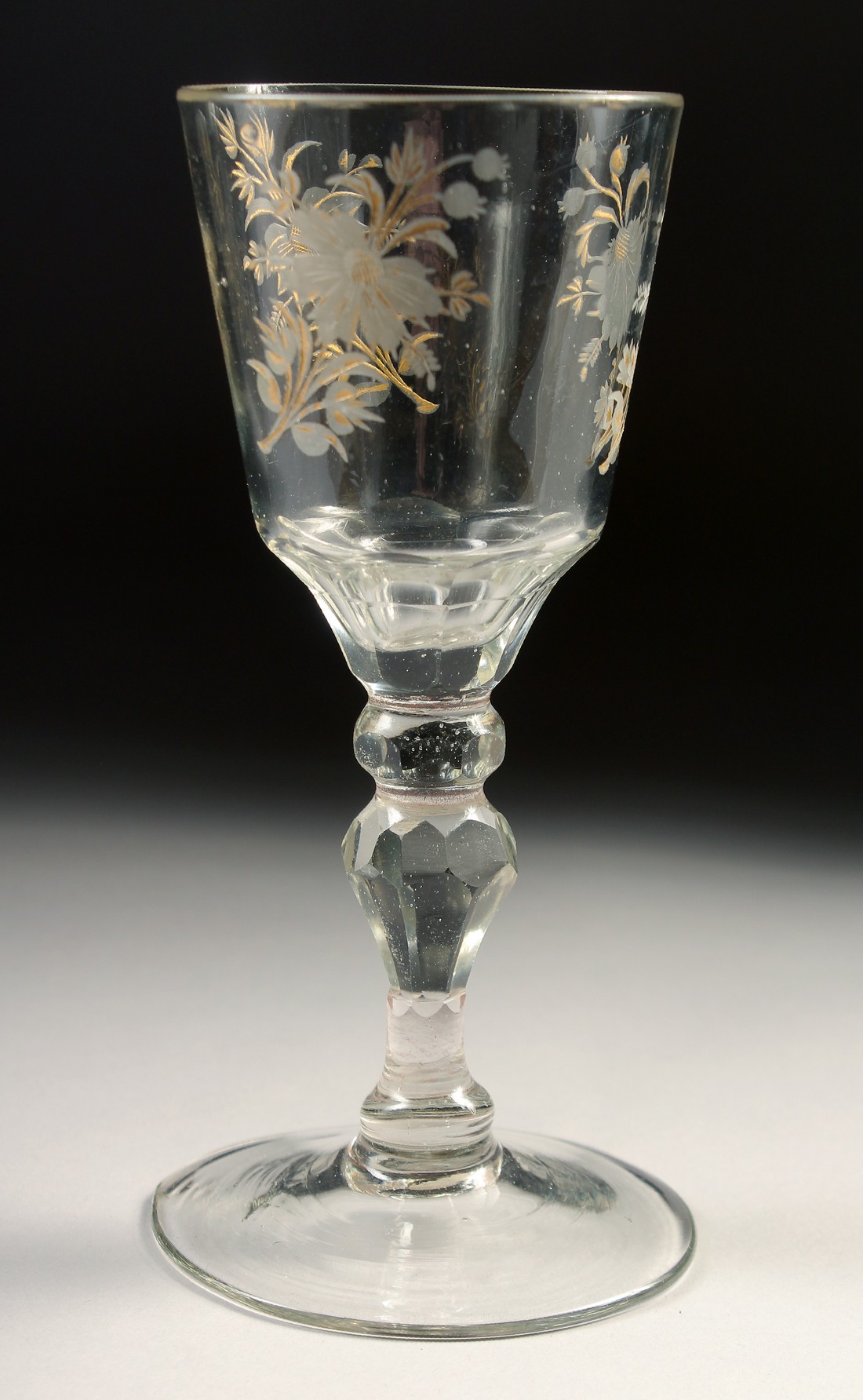 AN 18TH CENTURY DUTCH WINE GLASS with facet stem, the bowl engraved with flowers. 6ins high. - Image 3 of 4