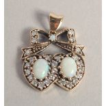 A 9CT GOLD, OPAL, AND DIAMOND SWEETHEART PENDANT.