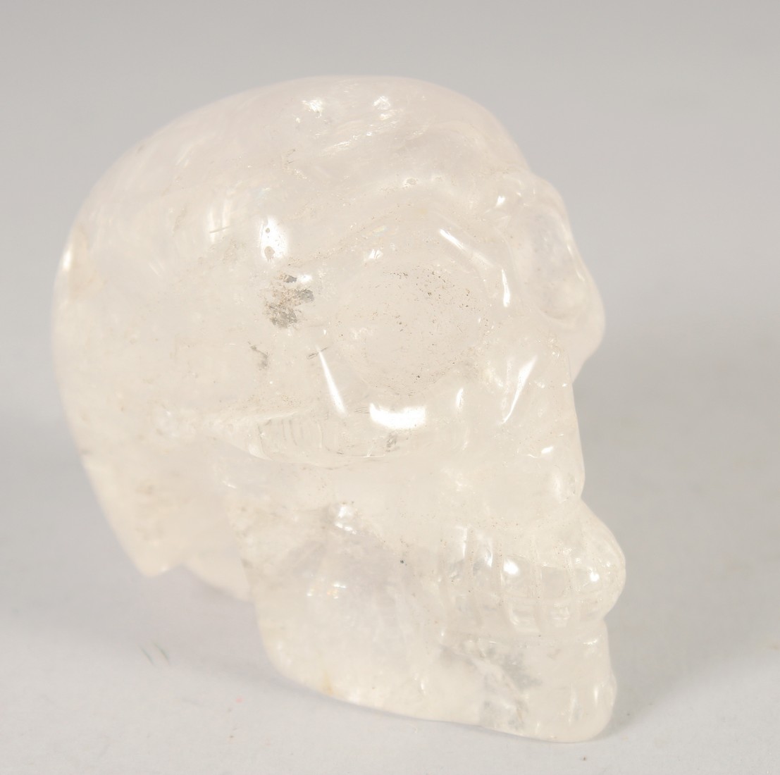 A SMALL CARVED ROCK CRYSTAL SKULL. - Image 2 of 2