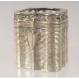 A DUTCH SILVER PILL BOX with ribbed decoration. 4cm high.