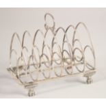 A GEORGE III SILVER SIX DIVISION TOAST RACK on four claw feet. London 1798. Maker: T. H. & G. H.