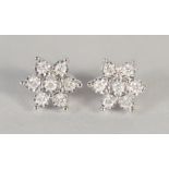 A GOOD PAIR OF 9CT GOLD DIAMOND CLUSTER EAR STUDS.