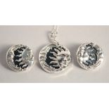 A SILVER AND ONYX CELESTIAL SUN AND MOON PENDANT AND EARRINGS.