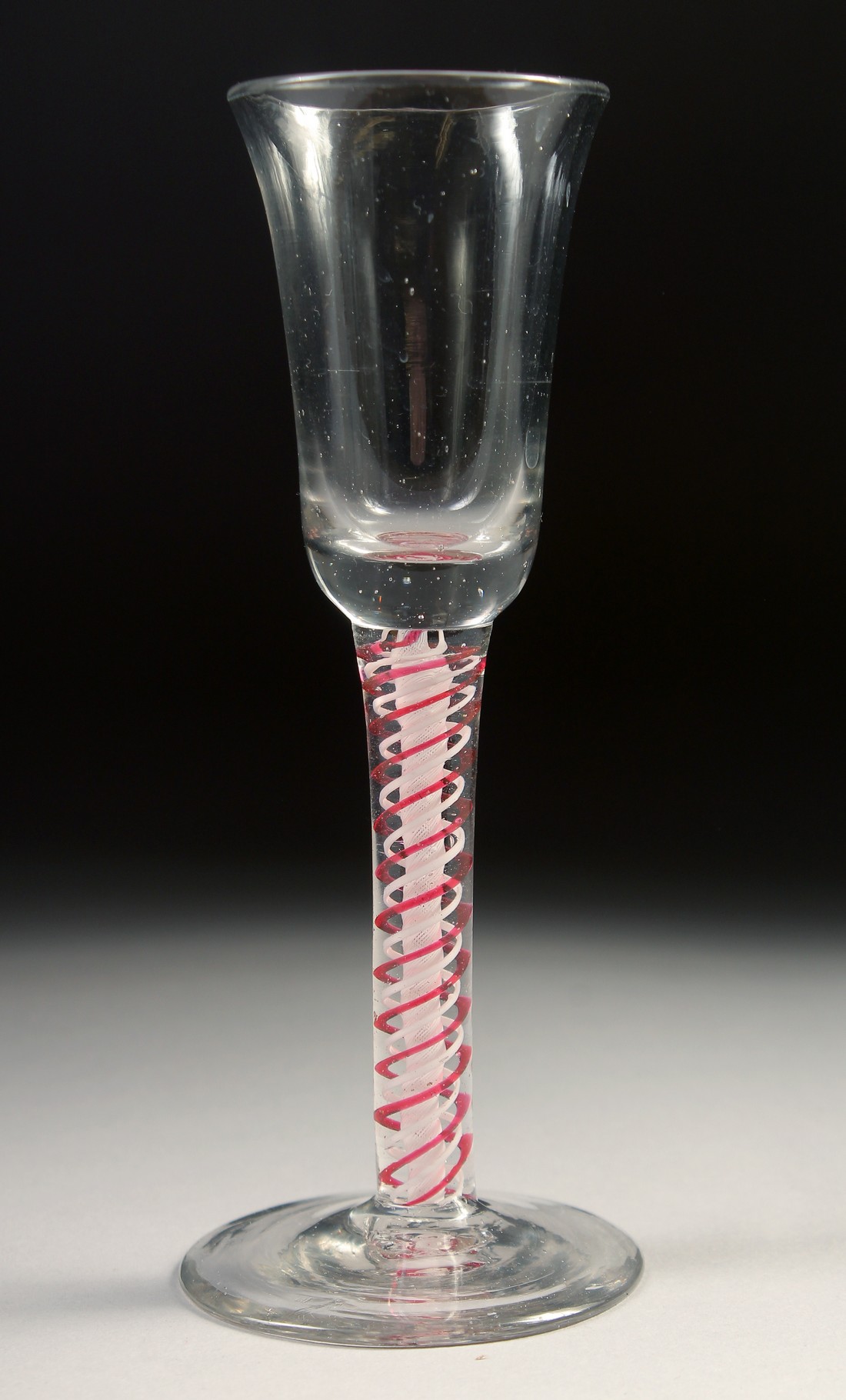 A DUTCH WINE GLASS with coloured twist stem 5.25ins high.