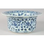 A CHINESE BLUE AND WHITE PORCELAIN WASH BASIN, decorated with flower heads and vine, the interior