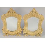 A PAIR OF GILT BRONZE EASEL STANDING MIRRORS. 12ins x 7.5ins.