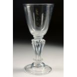 AN 18TH CENTURY WINE GLASS with pedestal stem. 5.75ins high.