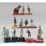 A COLLECTION OF FOURTEEN VARIOUS METAL SOLDIERS, on a stand, (14).