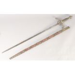 A REPLICA OF A RAPIER, early 20th century, narrow double edged 32in blade, brass hilt, downturned