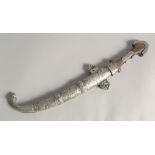 A 19TH CENTURY MOROCCAN KAMAYA SILVER MOUNTED DAGGER, and scabbard, 41cm long.