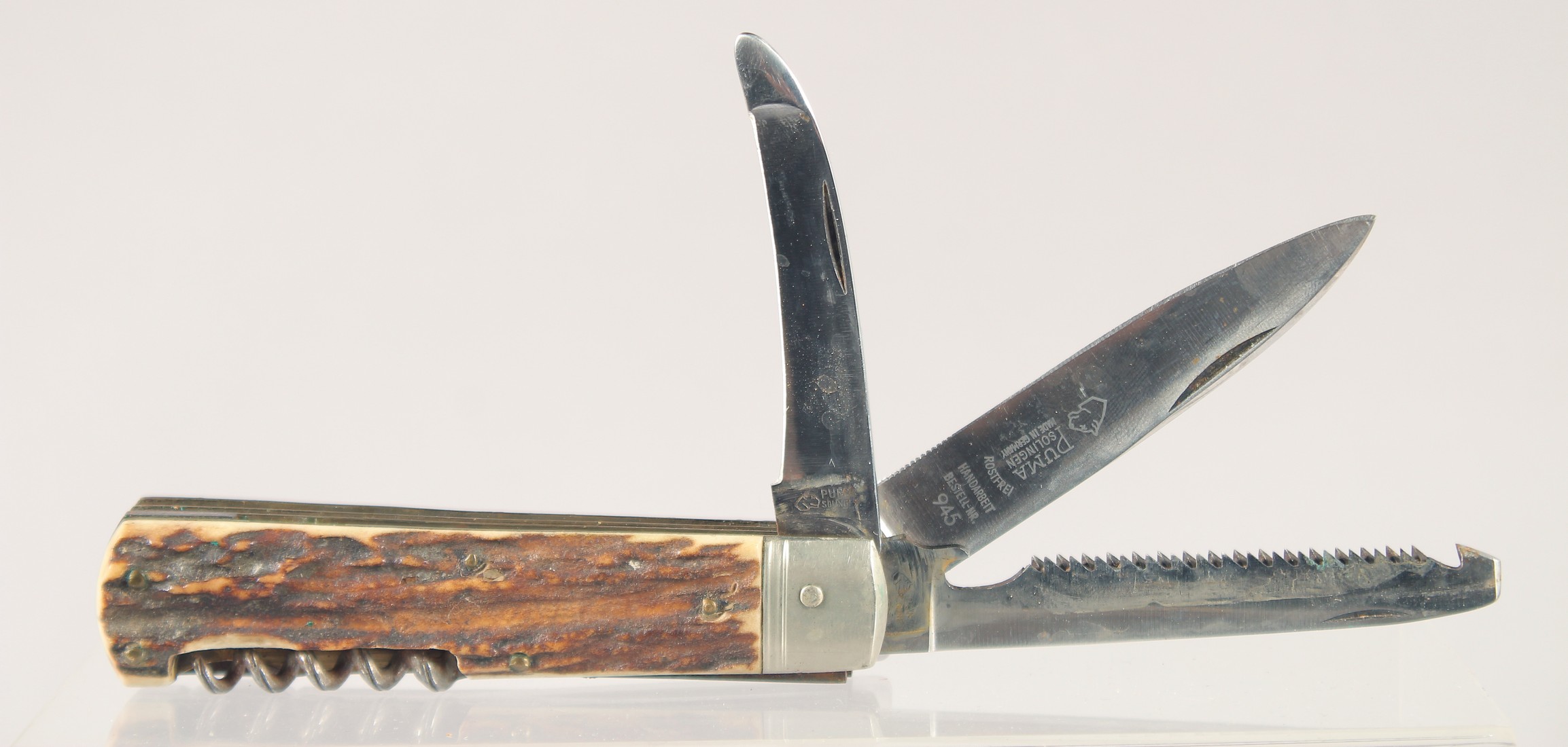 A PUMA ROSTFREI COMBINATION POCKET KNIFE, with antler handle, 4.5" long.