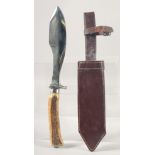 A HENEJU KNIFE, with an antler handle, 13" long, with a leather sheath.