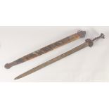 A THEATRICAL REPLICA OF AN IRON AGE SWORD, early 20th century, wide tapering double fullered pointed