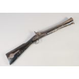 A LARGE INDIAN BLUNDERBUSS, mid-19th century, 32in long. Engraved two stage barrel with wide muzzle,