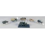 SIX VARIOUS DIECAST ARMORED VEHICLES, in a Perspex case.