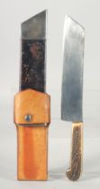 AN ANTLER HANDLE CHOPPER KNIFE, 13" long in a leather case, blade 1.5" wide.