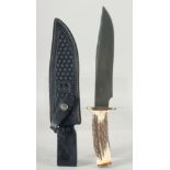 BOKER, an antler handle knife stainless steel blade 14" long in a leather scabbard.